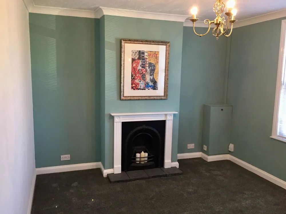 A renovated living room with a feature fireplace